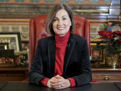 Gov. Reynolds sitting at desk