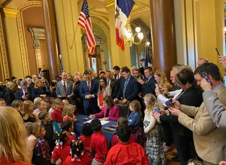 Gov. Reynolds signs Students First Act into law.