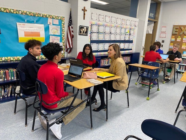 Gov. Reynolds sits with students