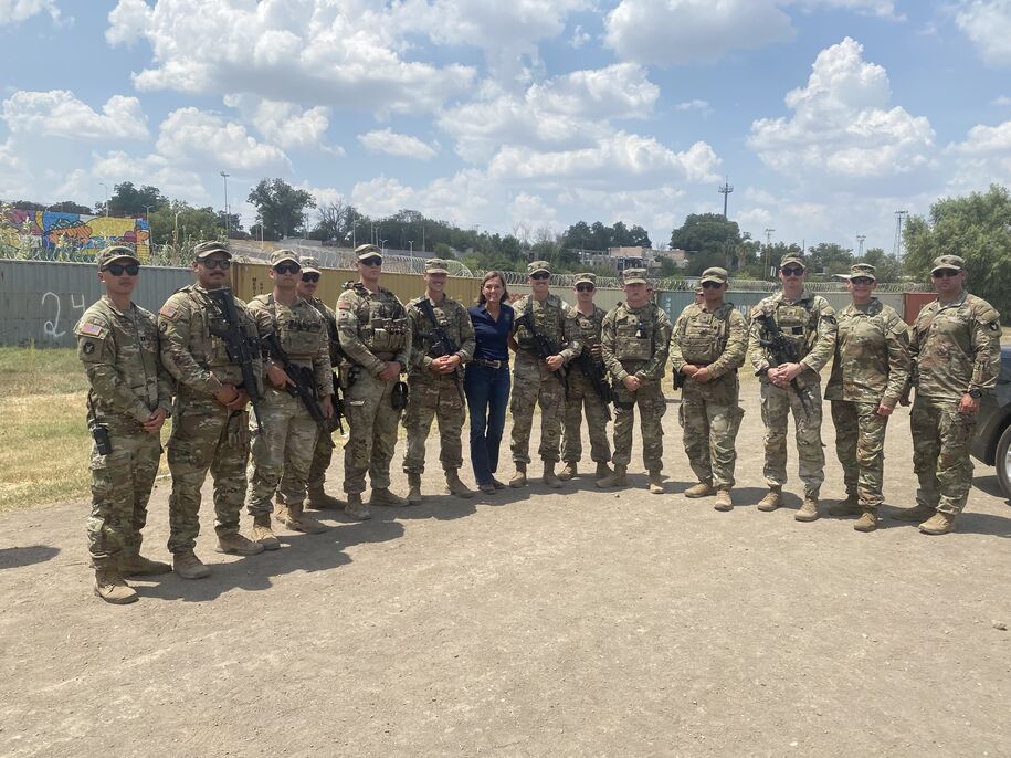 Governor Reynolds with members of the National Guard
